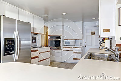 Compact kitchen room with white cabinetry Stock Photo
