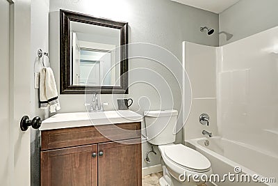 Compact light bathroom with soft gray walls Stock Photo