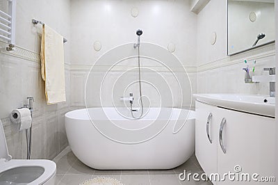 Compact white cozy bathroom with bathub Stock Photo