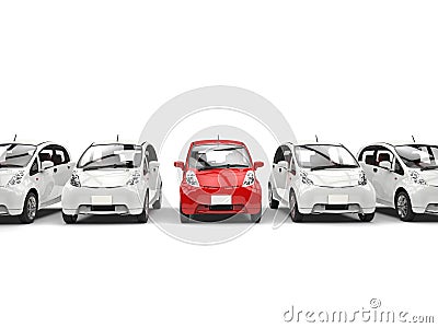 Compact white electric cars in a row - red stands out Stock Photo