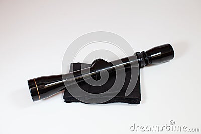 A compact, 3x9 magnification scope sits on a white background Stock Photo