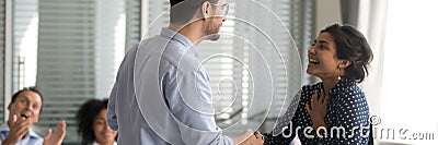 Company boss shake hands indian employee congratulate with promotion Stock Photo