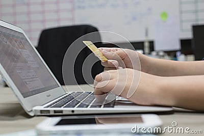 Company employees are buying products online and paying via credit cards online conveniently Stock Photo