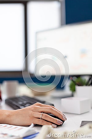 Company executive in his office using and clicking on mouse Stock Photo