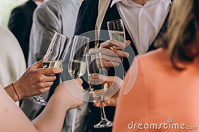 Company friends glasses champagne close hands party Stock Photo