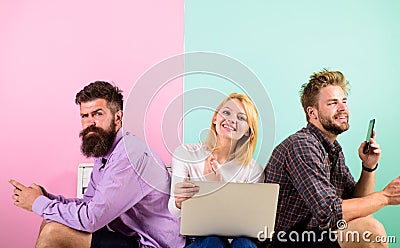 Company happy friends with mobile gadgets laptop. Men and woman have access to internet from everywhere. Mobile internet Stock Photo