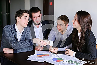 Company of insurance agents of women and men prepares opinion on Stock Photo