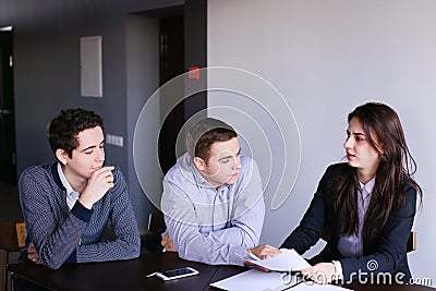 Company of insurance agents of women and men prepares opinion on Stock Photo