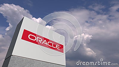 Logo of ORACLE on a stand against cloudy sky, editorial 3D rendering Editorial Stock Photo