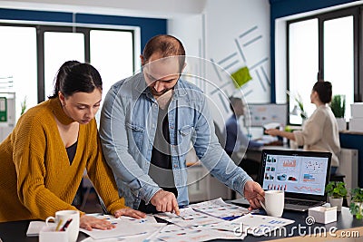 Company management working on important deadline in startup office Stock Photo