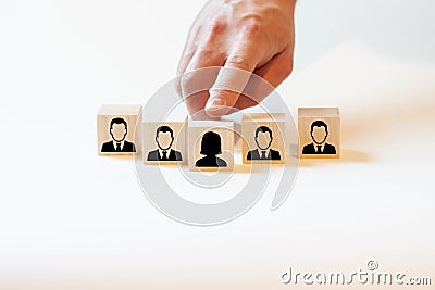 The company selects a woman for a managerial position, among men Stock Photo