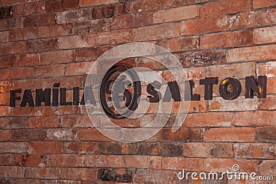 Company sign on brick wall at Salton Winery Editorial Stock Photo