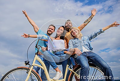 Company stylish young people spend leisure outdoors sky background. Cycling modernity and national culture. Bicycle as Stock Photo