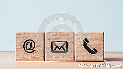 Company website contact screen on wooden cube include phone, address and email symbol. Business concept, customer contact Stock Photo