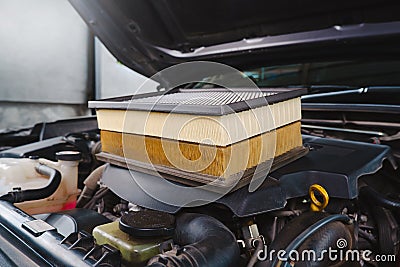 Comparing new and used car air filters Stock Photo