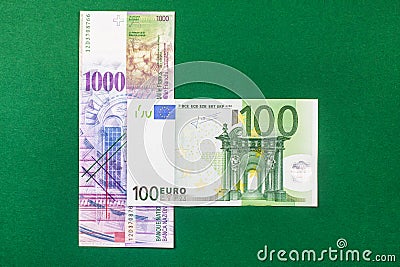 Comparison of Swiss francs and euros Stock Photo