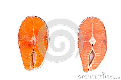 Comparison between wild and farmed salmon blocks on white backgr Stock Photo