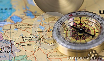 Compass on a close up map pointing at Moscow and planning a travel destination. Stock Photo