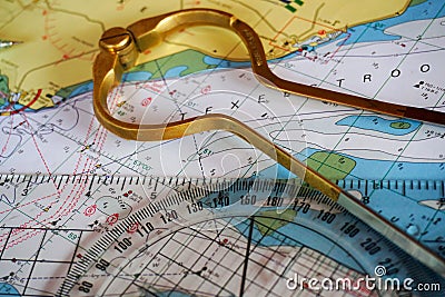 Compass course calculation, navigation, sea chart. Direction in meridians and parallels. Nautical chart and compass. Stock Photo