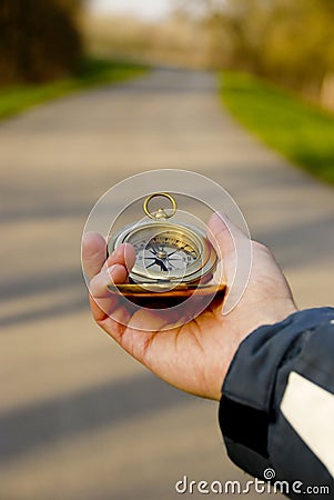 Compass in hand Stock Photo