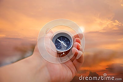 Compass in hand Stock Photo