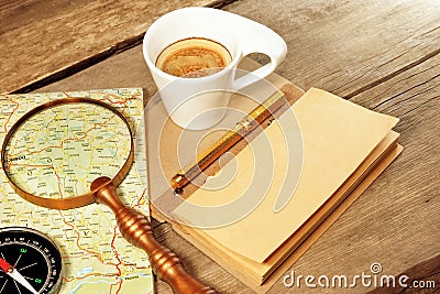 Compass Magnifier Vintage Notepad Gold Pen Coffee Cup Wood Table Stock Photo