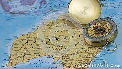 Compass on a close up map pointing at Australia and planning a travel destination. Stock Photo