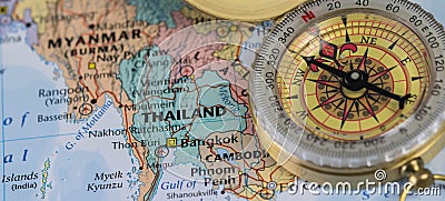 Compass on a close up map pointing at Thailand and planning a travel destination. Stock Photo