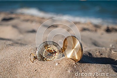 Compass on the sand Stock Photo