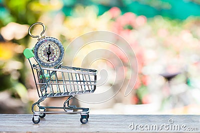 Compass in shopping cart Stock Photo