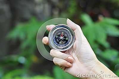 Compass in woman hand Stock Photo