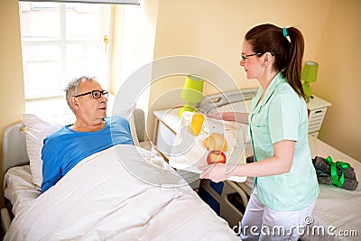 Compele a favor at nursing home Stock Photo