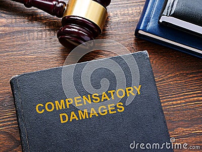 Compensatory damages law and wooden gavel. Stock Photo