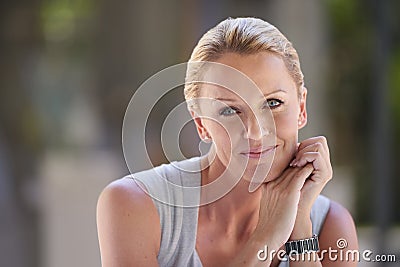 Competent and content. Cropped portrait of an attractive businesswoman sitting in the office. Stock Photo