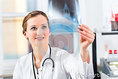 Competent doctor analyzes x-ray image Stock Photo