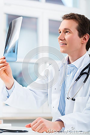 Competent doctor analyzes x-ray image Stock Photo