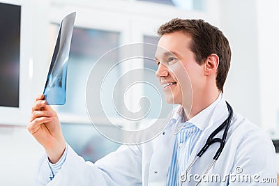 Competent doctor analyzes x-ray image Stock Photo