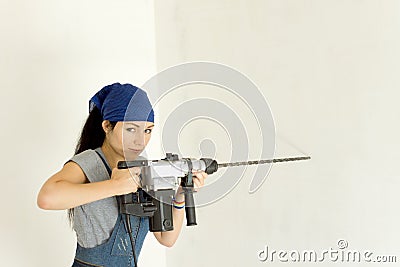 Competent woman with a cordless drill Stock Photo