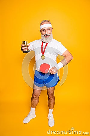 Competetive cool healthy modern successful active grandpa with t Stock Photo