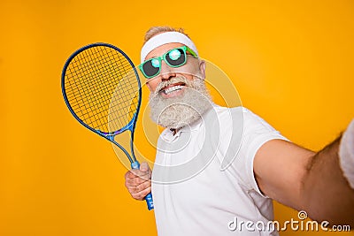 Competetive emotional cool grandpa with humor grimace exercising Stock Photo