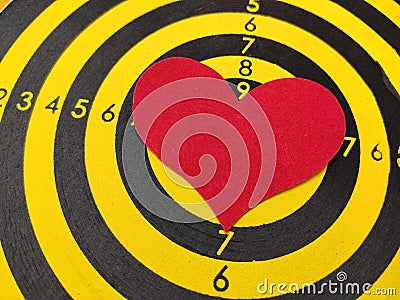 Paper heart on target for Valentines Day Stock Photo