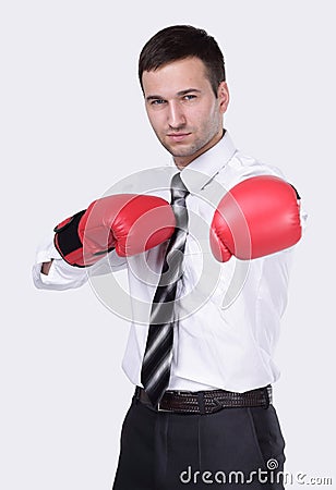 Competitive businessman in boxing gloves. Stock Photo
