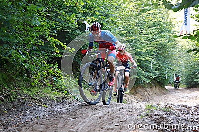 The competitors racing along the forest roads of the Tricity Landscape Park Editorial Stock Photo