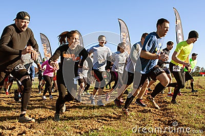 Competitors Sprint From Start Line At Obstacle Course Race Editorial Stock Photo