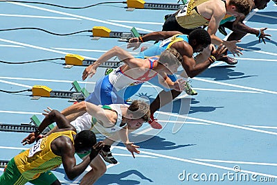 Competitors on start of 110m men hurdles Editorial Stock Photo