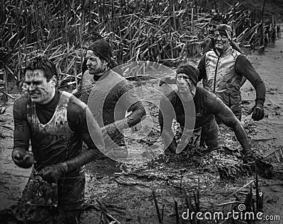 Competitors 2014 Tough guy obstacle race walking and crying Editorial Stock Photo