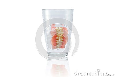 Complete Dentures in glass Stock Photo