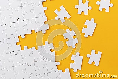 Almost Complete Jigsaw Puzzle with Scattered Missing Pieces Stock Photo