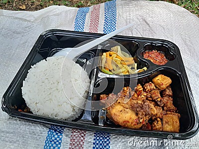 Complete lunch menu with rice and side dishes, which are ready to be enjoyed Stock Photo