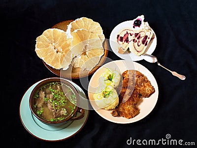 Complete menu (soup, mashed potato and fillet,dessert and pomelo fruit) Stock Photo